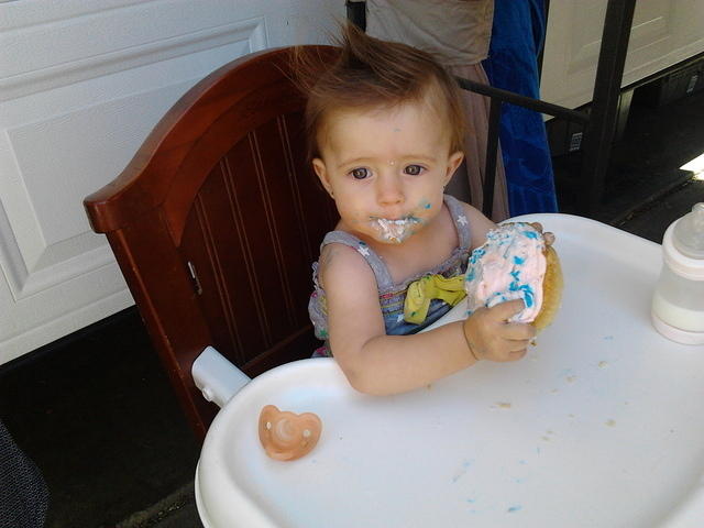 Eating her birthday cake. Year 1!