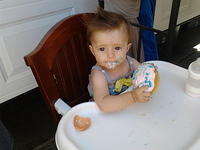 Eating her birthday cake. Year 1!